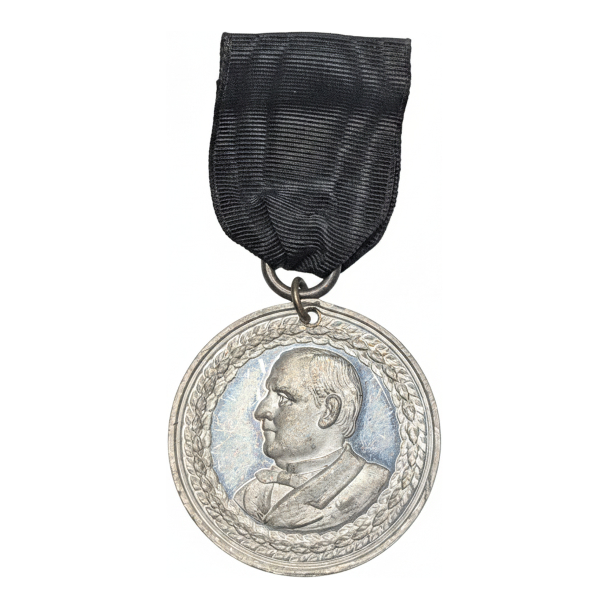 1901 William McKinley Memorial Badge with Original Mourning Ribbon, Bust of McKinley within a laurel wreath, on the original ribbon