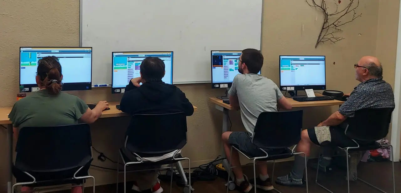 Participants working at computers during an Arc technology workshop