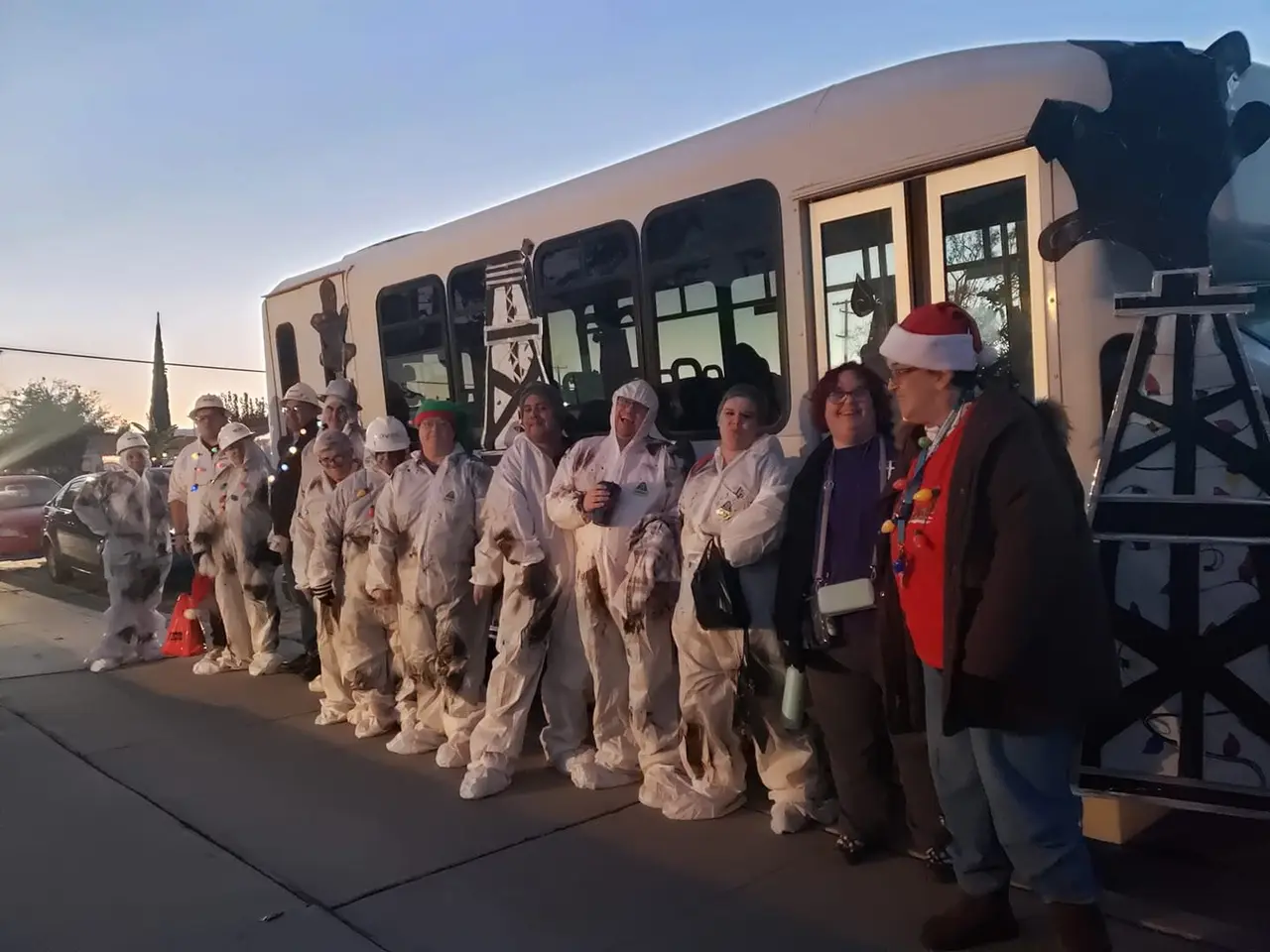 Arc Taft participants and staff waving from their community holiday parade float