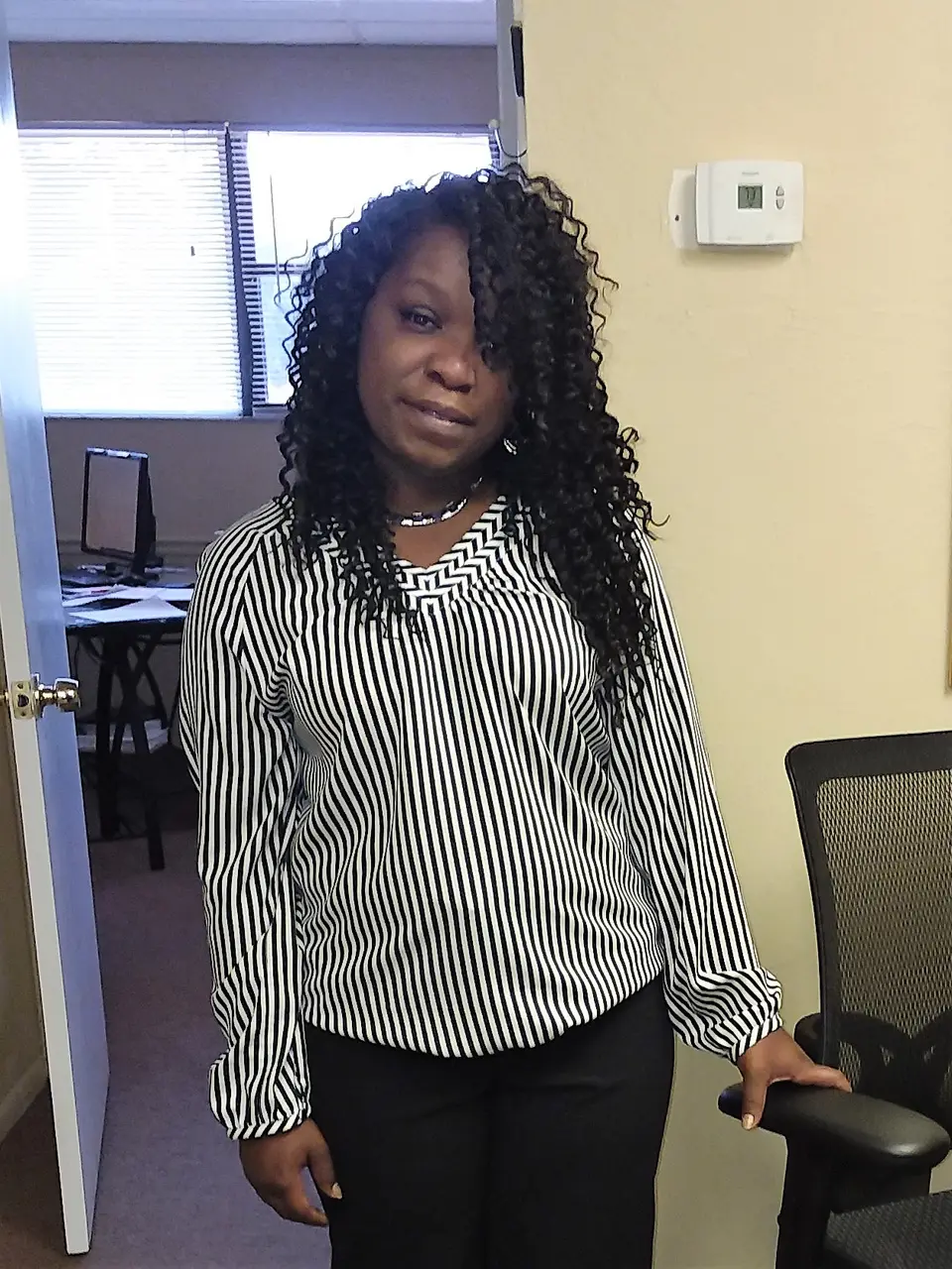 A Dress for Success SW Florida client in her new professional outfit