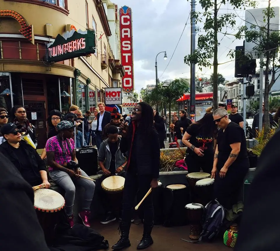 A drum circle performing on a Castro Street corner in San Francisco, from the Spectrum Queer Media archive