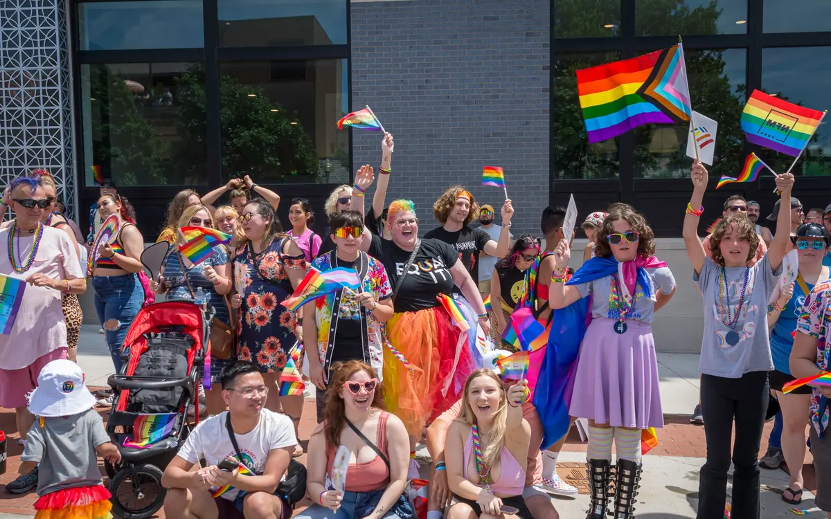 Participants marching and celebrating in the KC PrideFest parade organized by Our Spot KC