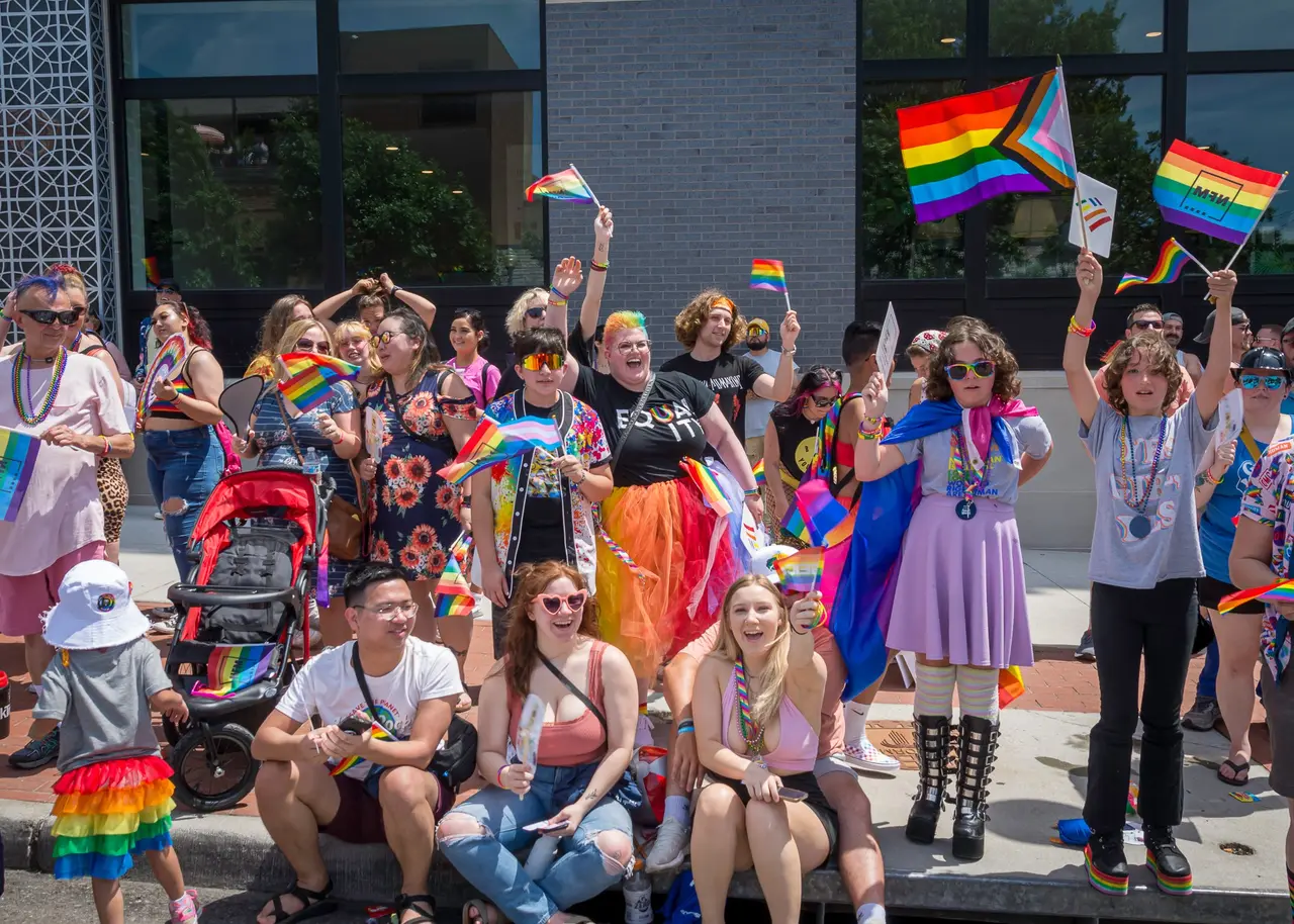 Participants marching and celebrating in the KC PrideFest parade organized by Our Spot KC