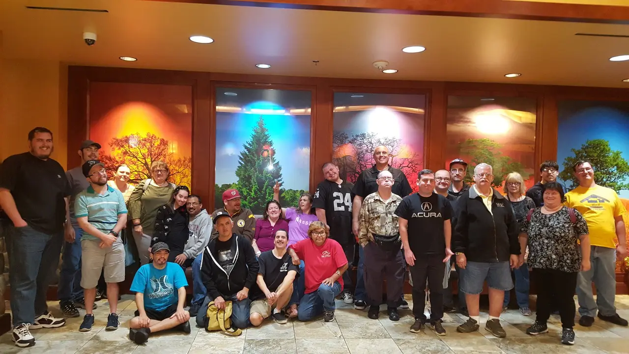 Work crew participants and supervisors celebrating accomplishments at a community luncheon