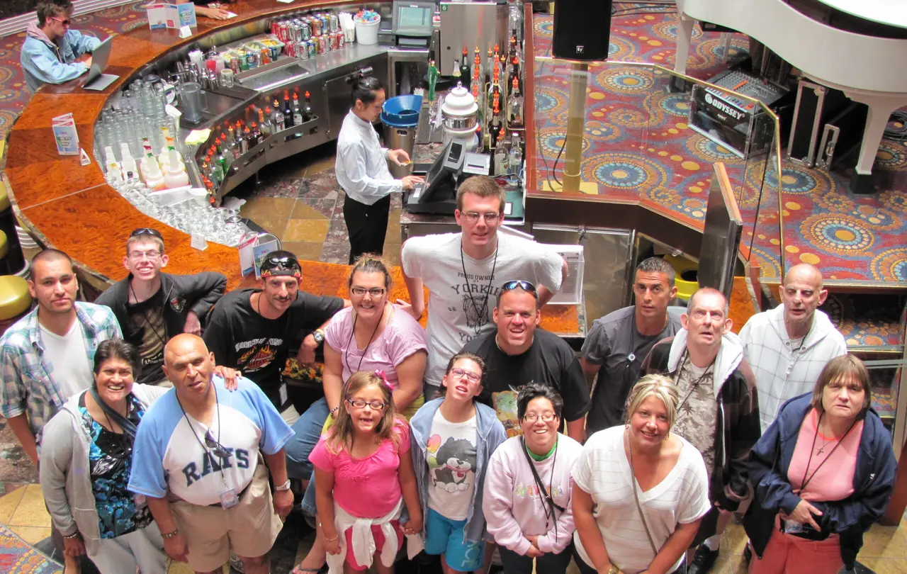 A group of Arc participants and staff gathered for a photo during an Arc Adventures cruise
