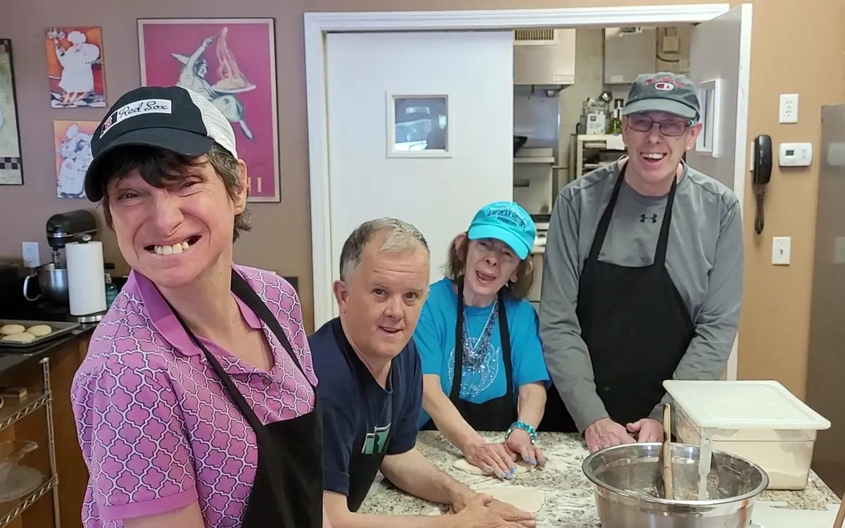 Participants and staff enjoying community activities at The Arc of the South Shore