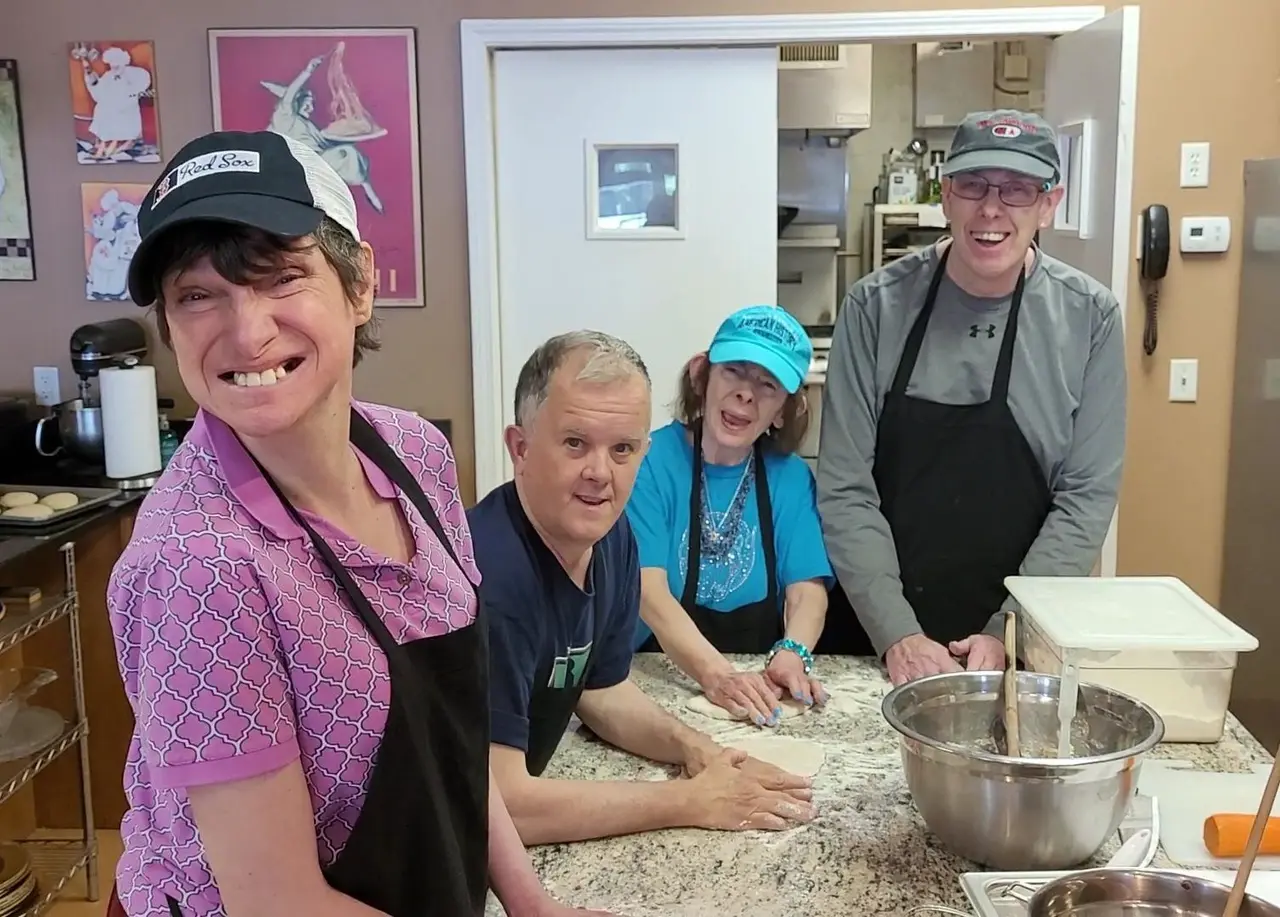 Participants and staff enjoying community activities at The Arc of the South Shore