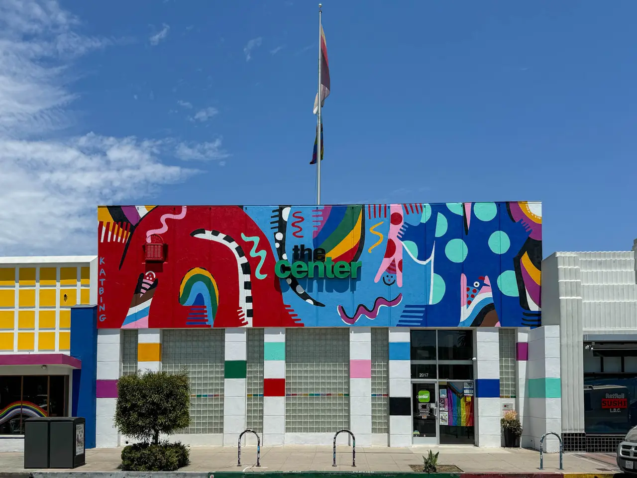 The LGBTQ Center Long Beach building on East 4th Street with its colorful mural and Pride flag