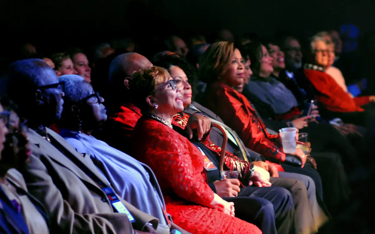 Community members and supporters smiling warmly in the audience at an Urban League of Greater Cleveland annual civic gala