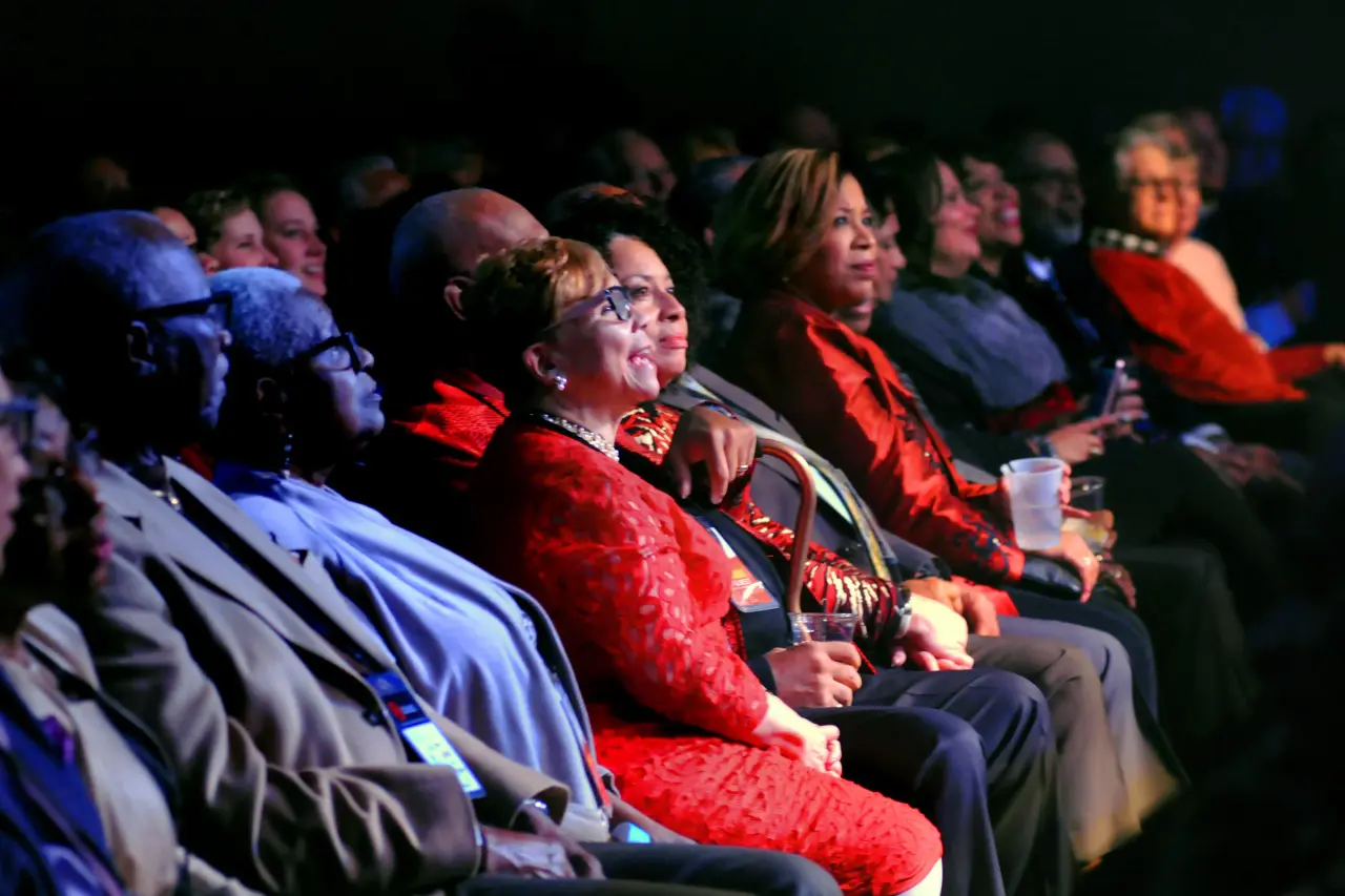 Community members and supporters smiling warmly in the audience at an Urban League of Greater Cleveland annual civic gala