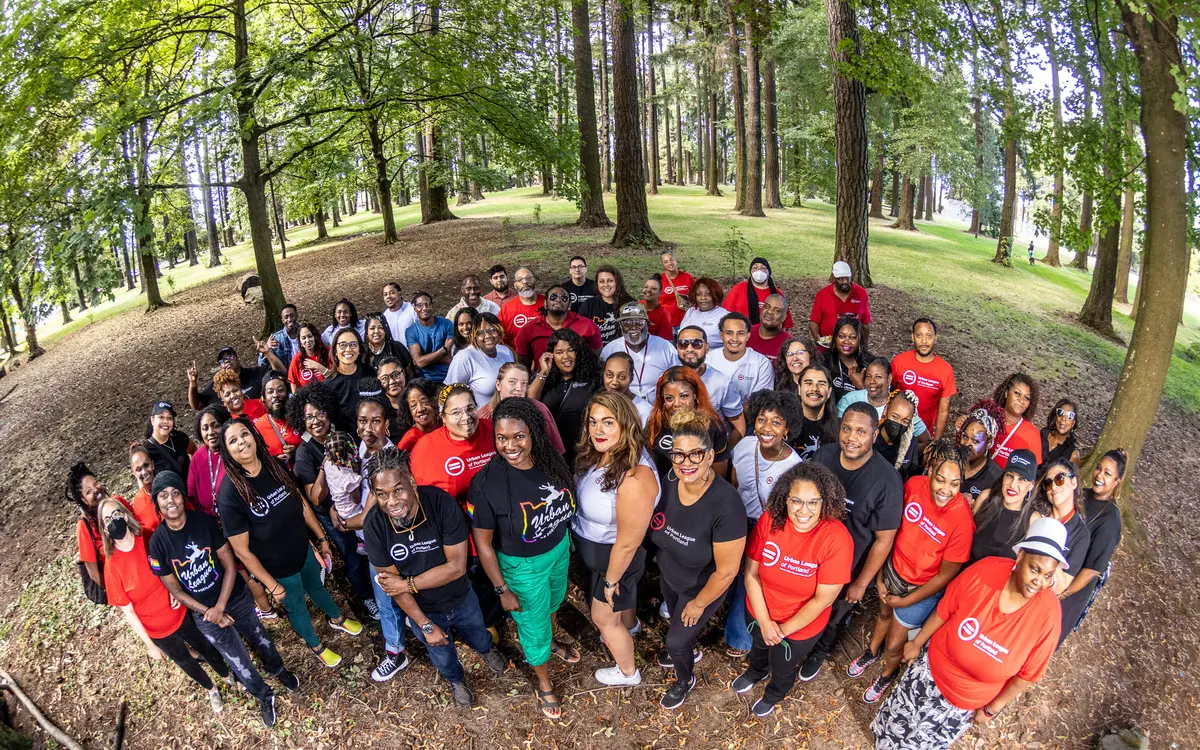 Urban League of Portland staff and community members gathered outdoors wearing organization shirts