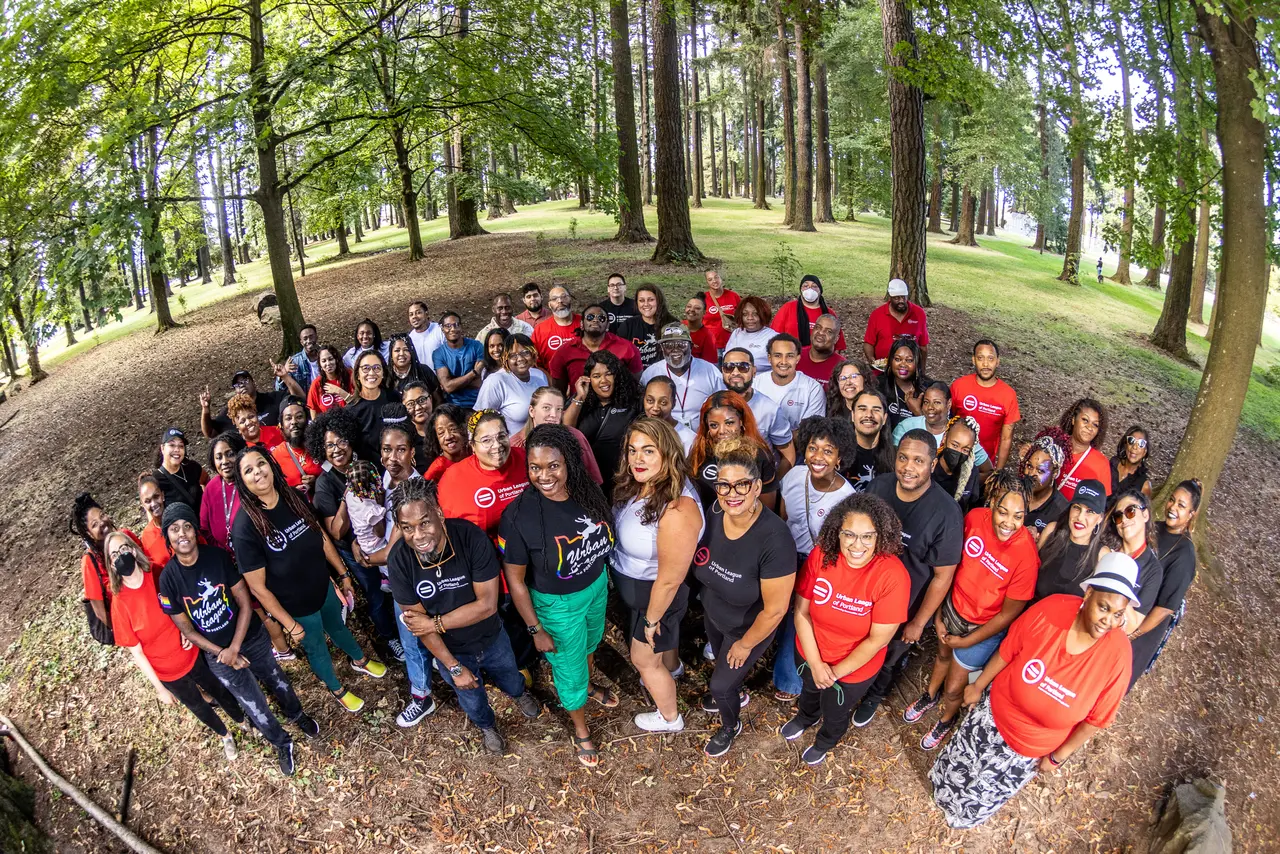 Urban League of Portland staff and community members gathered outdoors wearing organization shirts