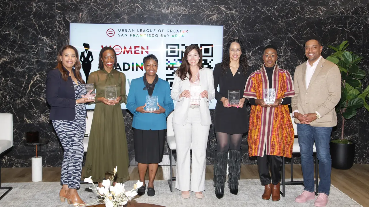 Six honorees holding awards on stage at the Urban League Bay Area Women Leading the Way event